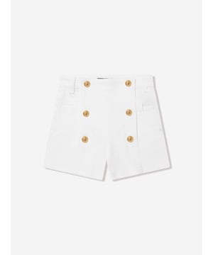 Balmain's raw Parisian mastery is embodied in these girls white gold shorts. Crafted in a beautiful military style with double gold coin buttons, pockets and belt loops. They are complete with the distinctive 'Balmain Paris' label.  92% Cotton  6% Modal  2% Elastane