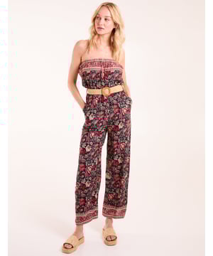 Opt for this fun printed jumpsuit as we move into warmer days ahead! Team this belted jumpsuit with gold sandals.