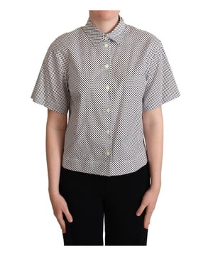 Completamente nuevo con etiquetas  
Elaborado con algodón de la más alta calidad  
Elegante patrón de lunares en tonos negros  
Hecho en Italia  
Polo de manga corta con cuello  
Presenta los icónicos detalles del logo de Dolce & Gabbana  
Color: Negro Blanco  
Material: 100% Algodón  
Género: Mujeres
