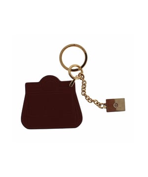 Dolce & Gabbana Keychain
  Color: Brown with gold metal detailing
  Material: 30% Brass 70% Leather
  Motive: MISS SICILY Bag
  Keyring attachment
  Logo details
  Made in Italy
  Brand new with tags
  Exclusive MainLine collection
