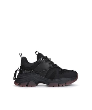 The KG Kurt Geiger Limitless sneaker features a black upper with lace up front. There are two KG Kurt Geiger logo tabs printed on ribbed textile with a print stitch detailing at the ankle. The tread is in a light pink shade.