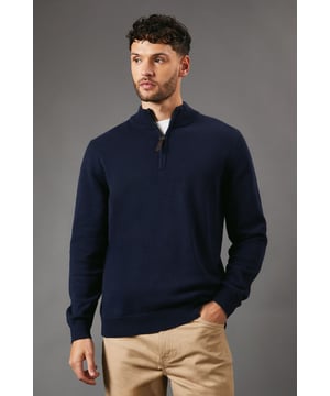 Pure Cotton Half Zip Funnel Jumper from Maine. Super-soft in texture and made from the premium fabrics, opt for this smart men's funnel jumper. Boasting cosy long sleeves, a high collar neckline with a zip-up front and a tailored cut finish for the perfect fit. Crafted from 100% Cotton. Wash at 40. Model wears a Size M.
