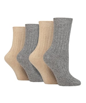 These ladies’ Wildfeet Cashmere Socks are the socks of luxury and comfort. Made from a blend of natural wool, viscose, and cashmere, they are designed to provide warmth and cosiness throughout the day, whether you're running errands or relaxing at home. These socks offer the perfect balance of luxury and practicality with a blend of wool, viscose, and cashmere. The soft and comfortable material provides warmth and insulation to keep your feet cosy in the cold weather while also being breathable and moisture-wicking. The combination of fibres makes these socks more durable, ensuring long-lasting wear, while the ribbed leg enhances comfort. The crew length and medium gauge thickness make them a good choice for any leisure shoes or boots, adding a touch of comfort to any outfit. These 4 pairs of Wildfeet Cashmere Socks come in 2 gift boxes and attractively wrapped with a satin ribbon bow, which makes them ideal for gifting to friends or family. Maybe even a last minute Christmas present or stocking fillers? Wild Feet is a range of socks featuring cool designs, bold colours and quirky catchphrases - from pugs and penguins, to lions and llamas! Choose from a range of styles for men and ladies, from dress to trainer socks. There are even some sporty styles available! There are 14 colours to choose from. They come in one size Ladies 4-8 UK, are made from 37% Wool, 27% Viscose, 24% Polyamide, 11% Cashmere, 1% Elastane and are machine washable.