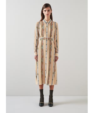 A silky shirt dress is an LKB favourite, and our new Kate dress takes on role with some Seventies styling. Crafted from a viscose-silk blend in a soft camel hue, it's treated to a vintage archive belt print in blue and red which has a heritage equestrian feel. It has a pointed collar, gold buttons, pretty pleating across the shoulders, long sleeves, a buckled belt and a midi-length skirt. Layer it up with boots and a knit now, and try it with socks and heels when spring says hello.