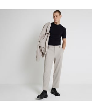 Tapered fit, Pleated fabric, Side slip pockets, Belt loops, Concealed zip and button fastening, Our model wears a UK 32 regular and is 186.5cm/6'1.5'' tall