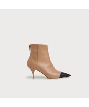 Our Athena ankle boots are a brand new style for autumn/winter. Drawing inspiration from the 1960s, they're sleek and understated. Crafted in Italy from a blend of camel and black soft calf leather, they have a pointed toe with toe cap detail, a streamlined shape with a back zip and a sexy kitten heel. Wear them with sharp tailoring or chic dresses.