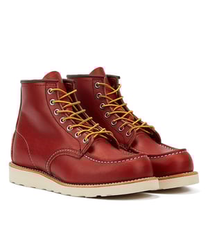 Step into style and durability with these boots made from Oro Russet Portage leather, featuring Moc toe construction and iconic Traction Tred rubber outsoles. The Puritan triple-stitching and Goodyear welt ensure both fashion and resilience, making it the perfect choice.