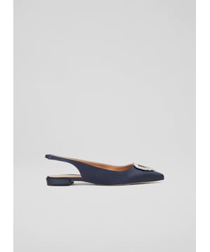 The definition of a 'fancy flat', the Luana slingbacks can elevate almost any look this spring/summer season with their subtle sparkle. Crafted in Spain from sumptuous navy blue satin, they have a pointed toe, a heart-shaped silver crystal brooch designed exclusively for LKB, an elasticated slingback, and a flat heel. Wear them to dress up a pair of jeans, or with dresses when you need a break from heels.