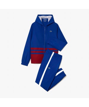 WH7566 Tennis Sportsuit Colourblock  Recycled polyester made from manufacturing offcuts Regular  slightly fitted cut Jacket lined in mesh Pants lined in jersey Silicone crocodile on side Tennis Sportsuit Colourblock  Recycled polyester made from manufacturing offcuts Regular  slightly fitted cut Jacket lined in mesh Pants lined in jersey Silicone crocodile on side