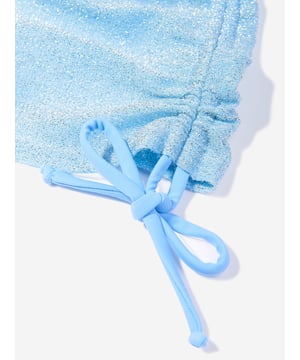 Nessi Byrd embody modern properties in their beautiful luxury resortwear. This girls Tinky ruffled skirt is reflective of the New York label's passion for vibrant aesthetics with an innovative twist. It features a cinched edge with a floral accessory in an allover glittered effect.100% Polyester
