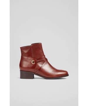 An ankle boot version of our Shelby knee-high boots, the Alba boots are a casual style with luxury details. Beautifully made in Italy from rich tan calf leather, they have a rounded toe, chic eyelet and strap detail, an inside zip and a 40mm wooden stacked heel. A great style for running around during the week and taking it easy on the weekends.
