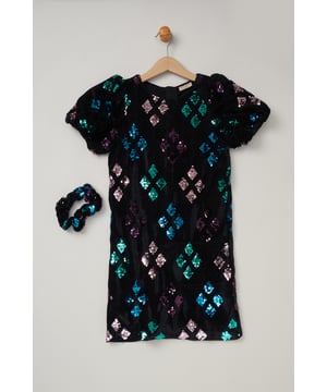 This adorable set from Miss is the perfect outfit for your little one. Features a short sleeve velvet dress in a cute all-over sequin and a matching hair scrunchie. This style is simple and elegant, the perfect outfit for weddings, birthdays, and party season!