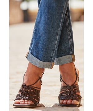 Elevate your summer outfits
Luxe woven straps for a statement look
Trending chocolate leather
Square toes are so now
Set on a high block heel with a supportive ankle strap
We love them with crochet or linen dresses