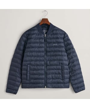 Lightly padded and quilted  this bomber jacket from GANT is ideal for transitional weather. Made with 100% recycled polyester filling and treated with a water-repellent finish  it features a ribbed collar  welt side pockets and elasticated cuffs. The fit is regular and sits just above the hips. This product has sustainability attributes in all layers: shell  lining and padding. All layers are made with recycled polyester.