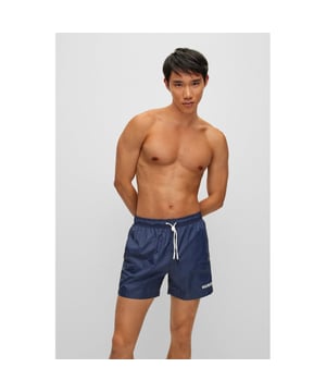 Signature swim shorts with full lining, by HUGO. Crafted in lightweight fabric with quick-drying performance, these swim shorts are detailed with branded drawcords and a contrasting HUGO logo.
Elastic waistbandDrawstringPockets bottom front: Side pocketsMedium length
100% Polyamide, Lining: 100% Polyester
50469312