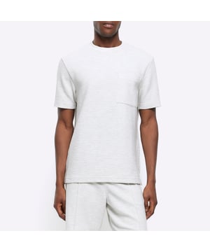Regular fit, Textured fabric, Chest pocket, Crew neckline, Short sleeves, Cotton for this product has been more responsibly sourced