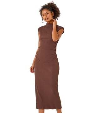 Dusk Ribbed Ruched Waist Midi Dress from Roman. Get ready to stun this Autumn Winter season in our ribbed midi dress. The high neckline gives a classic touch, while the soft cotton blend fabric and sleeveless design provide comfort and style. The ruched waist adds a flattering detail to this bodycon silhouette, all falling to a midi length. An easy pull-on style makes this a must-have dress for your wardrobe. Pair with winter boots, tights, and a coat for a cosy fall look!