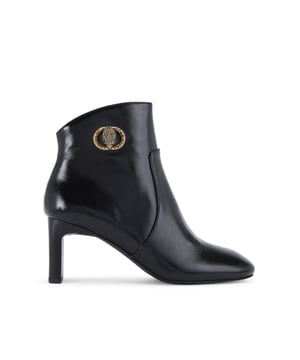 This Kurt Geiger Chelsea Square Toe Bootie is crafted from a black leather. There is an antiqued brass buckle with eagle head that is embellished with crystals sat on the outer side of the ankle. Heel height: 7.5cm.