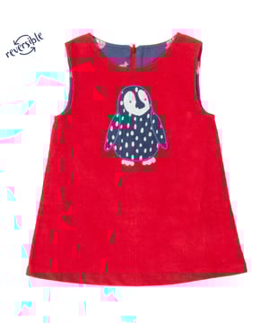 With our lovely penguin appliqué on red corduroy on one side and our little seal navy print on the other, this A-line reversible style will be the go-to dress of the season, but which cute side will you choose first? Team with our mini Peter Pan top and navy chevron tights for a lovely look.