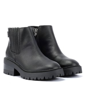 Step into style with these faux-leather upper boots featuring a sleek side stretch panel and inside zipper fastening. These chic and durable vegan boots offer the perfect combination of comfort and eco-friendly fashion.