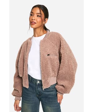 Keep things casual but always on-trend with a piece of outerwear perfection, the bomber jacket. A light jacket featuring a gathered, ribbed waistband and matching cuffs, a bomber jacket is versatile, timeless, and the perfect way to edge up your casual wear. Wear your new women's bomber jacket with a shirt and stripe joggers for the hottest look of the moment: sports luxe, or layer a varsity jacket over a t shirt dress for a fresh new-season look.Style: Teddy CoatFabric: BorgSleeve Length: Long Sleeve