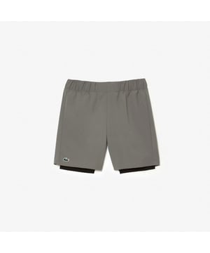 Men’s Two-Tone Lacoste Sport Shorts with Built-in Undershorts.- Regular fit, straight cut: Athletic cut.- Wide waistband with drawstring closure: Comfort first.- Contrasting cycle shorts and lining: A bright touch that’ll get you noticed.- Green silicone crocodile: Lacoste has your back.- Knit fabric with ultra-dry technology: Stay dry and give it your best. Material: 100% Polyester. Ref: GH5215Q9I.