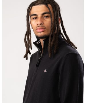 Your classic, wear-with-anything sweater. Crafted from 100% superfine lambswool, this sweater with a half-zip collar is perfect for layering. Cut for a regular fit with ribbed detailing at the hem and cuffs, this sweater is versatile and soft enough to justify getting one in every color.
Regular fit  Half-zip collar  Rib endings at hem and sleeve cuffs  GANT graphic embroidered at chest
&nbsp;
Lambswool 100%
&nbsp;
87213
&nbsp;
&nbsp;