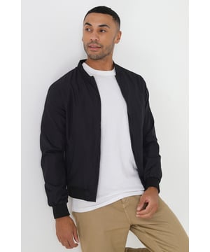 This bomber jacket from Brave Soul is a stylish and comfortable addition to your wardrobe. The ribbed hem, collar, and cuffs provide a classic touch, while the two lower zip pockets add a practical element to the jacket. With a regular fit, this jacket offers a relaxed yet trendy look and is fully lined. Whether you're heading out for a night out or running errands, this bomber jacket is sure to keep you comfortable and stylish.