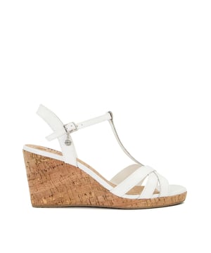 Leather upper.Adjustable ankle strap.Buckle fastening.Sandal toe.Mid-wedge heel.