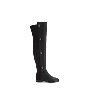 The Kurt Geiger Shoreditch boot features a grained leather upper which sits above the knee. The outer side of each boot features four antiqued brass eagle heads with crystals.