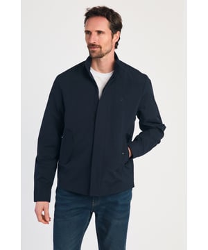This Harrington Style Jacket by Kensington Eastside features a button-up collar, pop button sleeves, and a durable PVC coating. The checked mesh inner lining enhances comfort, while two side pockets and an embroidered logo add style and functionality, making it a perfect choice for casual wear.
