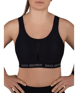 Shock Absorber Ultimate Run Padded Sports Bra. Non-wired sports bra designed for running with moisture-wicking material, wide padded racerback comfort straps, a wide underband and a double back fastening for ultimate support. Product is recommended hand-wash only.
