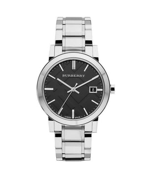 Burberry BU9001 Unisex Check Stamped Watch in stainless steel. The watch is powered by a quartz movement and fastens with a stainless steel bracelet. Other features include date function, black dial and baton hour markers. The watch comes with a Burberry presentation box. 38mm width