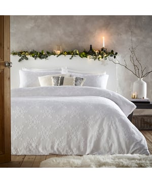 Add sophistication to your festive décor with the tufted snowflake duvet set. Made with 100% cotton and featuring snowflake tufting detail. Our snowflake bedding will add a cosy, textural look to your bedroom this winter. With a comfortable, breathable cotton percale reverse to help you have a better night’s sleep, this bedding is essential for an elegant festive bedroom.