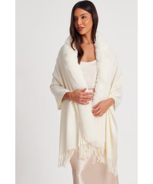 - Knitted - Faux fur collar - Tassel finish - Cape style - Always check the care wash label - Cool hand wash with mild detergent