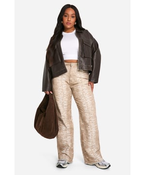 Wide leg silhouette for a relaxed, on-trend look
        Textured croc-print pattern adds visual interest
        High-rise waist for a flattering fit
        Denim fabric offers durability and comfort
        Versatile design suitable for various casual occasions
    
    Make a bold statement with these eye-catching plus-size jeans from Boohoo. The wide-leg silhouette combines comfort with style, while the unique croc-print pattern adds a touch of wild sophistication to your ensemble. Perfect for the fashion-forward woman who loves to stand out, these jeans can be dressed up or down for various casual events. Pair them with a crisp white crop top and trainers for a laid-back daytime look, or style with a sleek bodysuit and heeled boots for an evening out with friends. The high-rise waist flatters your curves, making these jeans an ideal choice for family gatherings or casual outings. Embrace your individuality and let your style roar with these standout denim trousers that are sure to turn heads wherever you go.