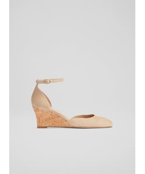 A new style in our spring collection, the Bre ankle strap wedges sport an on-trend cork heel, offering texture and a playful Seventies' feel. Crafted in Spain from super-soft and versatile beige suede, they have an almond-shaped toe, an ankle strap, a closed back of heel and a 65mm cork wedge heel. Wear them to elevate everyday pieces or as a chic, wearable choice during the occasion season.