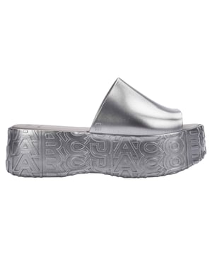 The Iconic Collaboration is here!  Melissa + Marc Jacobs has resulted in new styles that are both sustainable and fashion. The Platform is made using Melissa´s signature Melflex material, which is a type of PVC that is 100% recyclable. Made for those who want to look stylish while also minimizing their impact on the environment! The whole shoe features a unique design with Marc Jacobs signature and comes is a variety of colors, from classic black to bright red and blue.