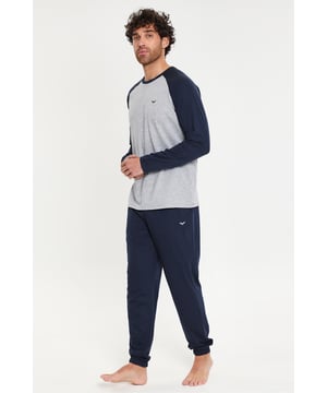 Get ready to relax in this two-piece loungewear set from Threadbare. This set consists of a long-sleeve, contrast raglan sleeve top and a pair of long, jogger-style trousers. The pyjama trousers feature two side pockets, an elasticated waistband with branded drawcords, and elasticated cuffs. Made in a super soft, cotton-blend jersey for comfort and easy care. This set is perfect for lounging at home or as a cosy bedtime outfit.