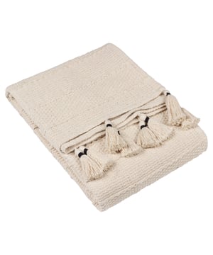If you love your textures, then head straight for the Caliche throw. It is adorned with relaxed linear and fine textural weaves that stretch fluidly across the design. Surrounding it is a tightly bunched, contrast yarn wrapped tasselled trim on two sides to add a plush finish. Available in a range of muted, natural tones, which will create an understated style for your home. Why not match with our Caliche cushion or other products in the Yard range to create an effortless relaxed look!