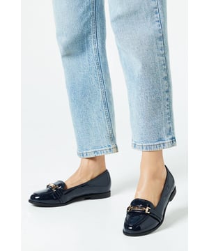 Wide fit design for enhanced comfort
        Sleek snaffle detail adorning the vamp
        Flat heel measuring between 0 and 2cm
        Faux leather construction for a polished look
        Versatile loafer style suitable for various occasions
    
    Step out in style and comfort with these chic Lora Snaffle Loafers from Dorothy Perkins. Perfect for the fashion-conscious woman who values both trend and practicality, these wide fit flats offer a seamless transition from day to night. The classic loafer silhouette is given a modern twist with the eye-catching snaffle detail, adding a touch of sophistication to any ensemble. Pair them with tailored trousers and a crisp blouse for a polished office look, or dress them down with your favourite jeans for a casual brunch with friends. The versatile design makes these loafers an ideal choice for baby showers or dinner dates, effortlessly complementing a variety of outfits. With their flat heel and comfortable fit, these loafers are perfect for those busy days when you're on your feet but don't want to compromise on style.