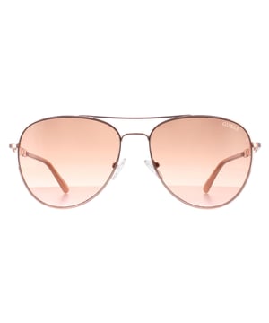 Guess Aviator Womens Shiny Rose Gold Brown Gradient GF6143  Sunglasses are a glamorous aviator frame, exuding a sense of timeless elegance. The frame is crafted from high-quality metal, known for its durability and lightweight feel, ensuring long-lasting comfort throughout the day. The slender temples feature the Guess logo for authenticity.