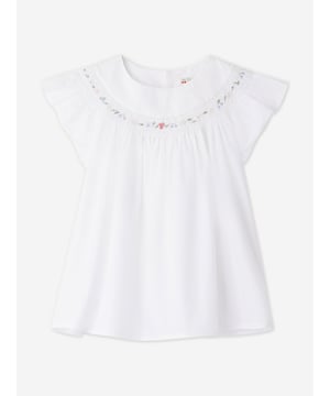 Bonpoint's totally French aesthetics have been depicted with care and beautiful precision. This girls Fillys short sleeve t-shirt amplifies the label's sophisticated portfolio and adoration for traditional concepts. Crafted in cotton poplin via an elegant flared cut. It showcases delicate hand-embroidered smocking on the neckline, along with colourful motifs that include the famous Bonpoint cherry.  Button Fastening At the Back Crew Neck 100% Cotton
