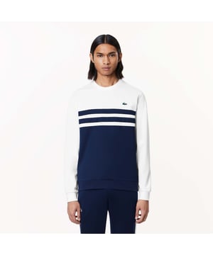 Designed for Tennis  for a regular frequency of use This product is in Interlock which guarantees you a resistant fabric making it adapted to high repetitive movements during training sessions. This sweatshirt is made in 100% recycled polyester Classic fit: comfortable ease on body  with comfortable sleeves The technical capsule offers the complete seasonal wardrobe on and off court with a strong design identity. LACOSTE wording print at back neckline.