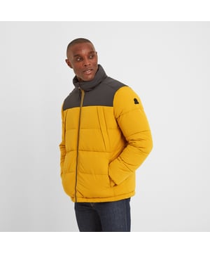 Designed to stand up to the rigours of a Yorkshire winter, our Calverley quilted puffer jacket is wind resistant and extra warm. This substantial jacket with chunky, stitched baffles is thickly padded with a warm, insulated eco filling made from recycled plastic bottles, so you’ll be doing your bit for the planet too. Elasticated cuffs and toggle adjusters at the hem keep the wind out and the warmth locked in and two lower zip-up pockets can double up as hand warmers. Calverley also has two angled zip up chest pockets to safely store your valuables when you’re out for a hike across the moors. Calverley comes in muted colours inspired by the rugged Yorkshire coastline and has a contrast colour neck and yoke for added interest. The finishing touch is a TOG24 printed logo on the chest and our signature TOG24 rose rubber badge on the sleeve.