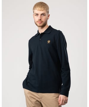 Mens Belstaff Long Sleeved Polo Shirt in dark ink.- Ribbed polo collar.- Two button placket.- Long sleeves with ribbed cuffs.- Embroidered edge Phoenix logo patch at left chest.- Uneven vented hem.- Textured cotton piqué.- Regular fit.- Body: 100% Cotton.  Rib: 100% Cotton.  Machine washable.- Ref: 101397DKINK