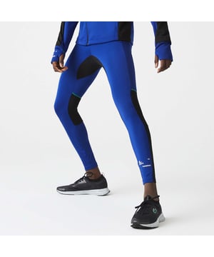 Men's Lacoste SPORT Leggings.- Recycled stretch interlock and mesh.- Elasticised waistband.- Small pockets for keys on inside, contrast flat stitching, branding on ankle.- Tight fit.- Tone-on-tone silicone crocodile on hip. Material: 77% Polyester, 23% Elastane. Ref: XH1045PHK.