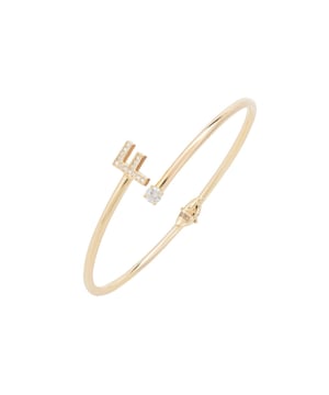 Design:This simple but beautifully styled initial bangle bracelet is perfect for those who covet delicate jewellery with a hint of sparkle, offering a sophisticated finishing touch to any outfit.Pretty and petite, this initial open cuff bangle features a hinge on the underside which makes it easy to put on and take off. The opening is designed to be on top of the wrist, where a zircon adorned monogram sits on one side and a single larger cubic zirconia resides on the other.What can be more personal than a name? Give this initial bangle bracelet as the perfect personalised birthday gift. Materials:Handcrafted using 925 sterling silver, dipped in 22ct gold. White cubic zirconia.Style Notes:Perfect pairing to the initial ring.Personalised birthday gift ideas. Bridesmaid gifts. Simple everyday styling.Dimensions:Bracelet: 19.5cm Packaging:This item is presented in a Latelita London signature jewellery box.Care Instructions:To maintain your jewellery, wipe gently with a damp cloth that is soft and clean. Do not soak in water. Avoid contact with soaps, detergents, perfume or hair spray.
