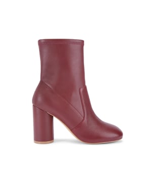 This Langley Round Ankle Boot features a wine upper crafted from a soft leather. The heel is rounded matching the toe shape. Heel height: 9cm.