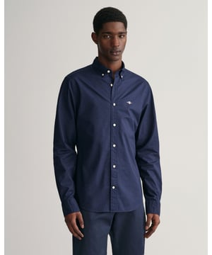 Crafted in a durable poplin weave, this classic shirt is essential to any preppy wardrobe. Featuring an '80s-inspired GANT shield graphic embroidered at the chest, wear it with tailored pants and an upscale shoe for an elevated look.


Slim fit
Button-down collar
Knife pleat with locker loop at back
GANT graphic embroidered at chest


&nbsp;
Material: Cotton 100%
3000102
&nbsp;
&nbsp;